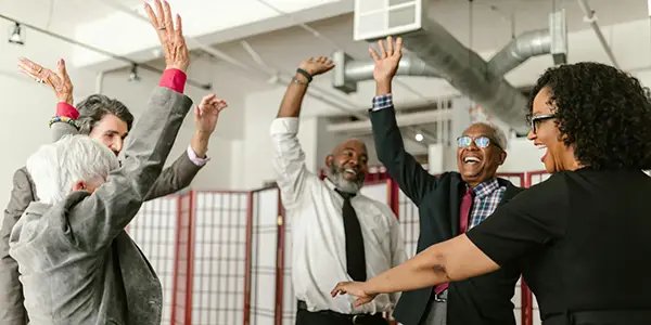 people celebrating their success